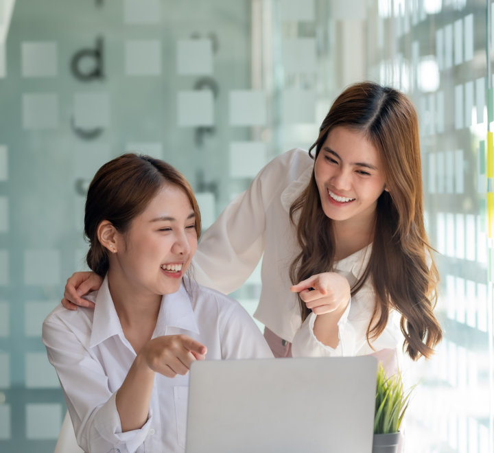 two young woman smiling