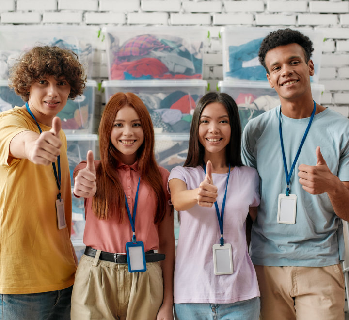 group of young people doing thumbs up